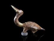 A EUROPEAN LATE BRONZE AGE FIGURINE OF A BIRD
Circa 12th-9th century BC.
Small bronze figurine in the shape of a duck, with a loop for attachment (p...