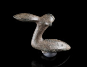 A EUROPEAN LATE BRONZE AGE FIGURINE OF A BIRD
Circa 12th-9th century BC.
Small bronze figurine in the shape of a duck with horns; remains of a stud ...