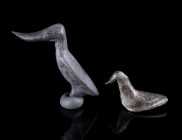 TWO EUROPEAN LATE BRONZE AGE BIRD FIGURINES
Circa 12th-9th century BC.
Small bronze figurines in the shape of a bird; one with a stud for attachment...
