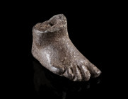 A ROMAN BRONZE FOOT OF A STATUETTE
Circa 1st- 3rd century AD.
A (partly) hollow cast foot of a statuette. The proportions suggest that it belonged t...