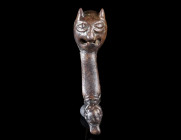 A SELJUK BRONZE CASKET FOOT WITH A LION'S HEAD
Circa 11th-13th century AD.
With a stylised lion's head with pointed ears and open mouth. The foot te...
