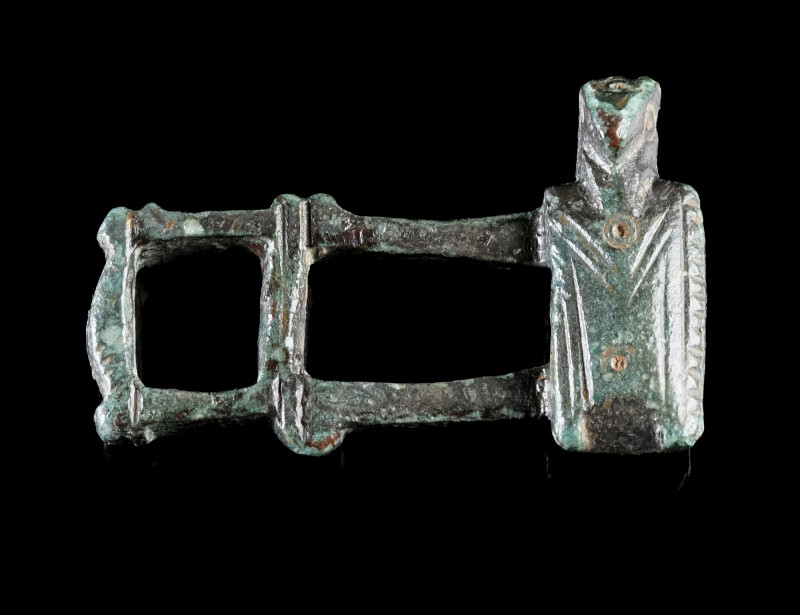 A BYZANTINE BRONZE FIGURAL CLASP
Circa 8th-12th century AD.
Clasp with a styli...