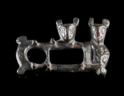 A BYZANTINE BRONZE FIGURAL CLASP
Circa 8th-12th century AD.
Clasp with two stylised figures; incised/punched decoration.
L 30 mm

Austrian privat...