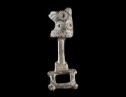 A BYZANTINE BRONZE CLASP WITH A HORSE HEAD
Circa 8th-12th century AD.
Clasp with a stylised horse head to left; incised and punched decoration.
L 4...