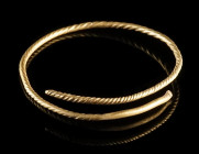 A EUROPEAN BRONZE AGE TWISTED GOLD RING
Circa 12th-9th century BC.
Ring made from twisted gold wire.
Diameter 34 mm; Gold! 2.83 g

Ex European pr...