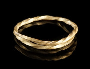 A EUROPEAN BRONZE AGE TWISTED GOLD RING
Circa 12th-9th century BC.
Ring made from twisted gold wire.
Diameter 23 mm; Gold! 2.11 g

Ex European pr...