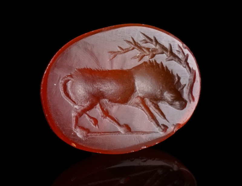 A ROMAN CARNELIAN INTAGLIO WITH A YOUNG BULL
Circa 1st century AD.
Skilfully c...