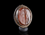 A ROMAN SARD INTAGLIO DEPICTING MINERVA
Circa 2nd-3rd century AD.
Silver bezel from a small ring with an oval intaglio featuring Minerva with spear ...