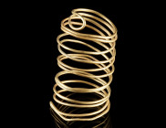 A EUROPEAN BRONZE AGE GOLD SPIRAL
Circa 12th-9th century BC.
Made from a continuous loop of gold wire doubled up and bent into a spiral.
H 45 mm; G...