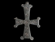 A LARGE BYZANTINE BRONZE CROSS PENDANT
Circa 10th-12th century AD.
The cross arms are in the corners further embellished with small 'disks' (one par...