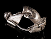 A ROMAN SILVER ANCHOR-TYPE BROOCH WITH INSCRIPTION
Circa 2nd-3rd century AD.
Nicely toned bow brooch with an anchor-shaped head. The foot terminates...
