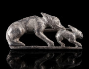 A MAGNIFICENT ROMAN SILVER HARE AND HOUND BROOCH
Circa 2nd-3rd century AD.
Detailed openwork plate brooch. The brooch shows in high relief a hound w...