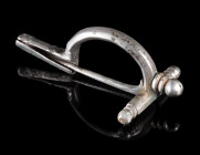 A ROMAN SILVER EARLY CROSSBOW BROOCH
Circa second half of 3rd century AD.
So-called 'Scharnierarmfibel', a direct precursor of the classical crossbo...