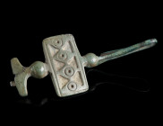 A CELTIC LA TENE PERIOD BRONZE FIBULA
Circa 3rd century BC.
The foot is bent upwards and attached to the bow. The bow is decorated with a rectangula...