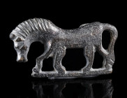 A ROMAN TINNED BRONZE HORSE BROOCH
Circa 2nd-3rd century AD.
Brooch in the shape of a horse striding to left; set on a horizontal base. Much of the ...