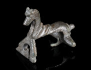 A ROMAN BRONZE HORSE BROOCH
Circa 2nd-3rd century AD.
Brooch in the shape of a horse, worked three-dimensional. Some remains of tinning. With hinged...
