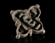 A QUATREFOIL BYZANTINE BRONZE BREAD STAMP
Circa 5th-8th century AD.
With the Greek letter Epsilon (ε) centrally; a small, pierced handle at the back...