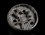 A CIRCULAR BYZANTINE BRONZE BREAD STAMP
Circa 5th-8th century AD.
With the Greek letters XHΣ; a small strap loop/handle at the back.
Diameter 42 mm...