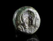 A BYZANTINE BRONZE STAMP SEAL WITH A MILITARY SAINT
Circa 8th-10th century AD.
Domed seal matrix with suspension loop depicting a nimbate, cuirassed...