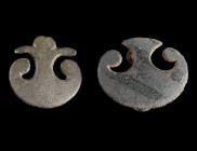 TWO ROMAN BRONZE PELTA-SHAPED BELT FITTINGS
Circa 2nd-3rd century AD.
Pelta-shaped fittings with two fungiform studs each for attachment on the reve...