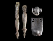 A GROUP OF FOUR ROMAN BRONZE OBJECTS
Circa 1st-3rd century AD.
Two pendants from a Noric-Pannonian belt, a profiled belt stud or mount, and an armou...