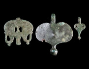 THREE PENDANTS FROM EARLY ROMAN MILITARY HORSE HARNESSES
Circa 1st century AD.
Heart/leaf-shaped pendants with suspension hook; the smallest could a...