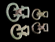 A GROUP OF FOUR ROMAN BRONZE MILITARY BELT BUCKLES
Circa 2nd-3rd century AD.
D-shaped with a triangular or rectangular loop at the back. One with br...