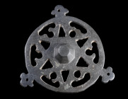 A MEDIEVAL BRONZE OPENWORK MOUNT
Circa 10th-14th century AD.
Circular mount with an openwork design around a central boss. Three trefoil extensions ...