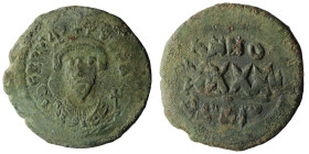 PHOCAS. 602-610 AD. Æ Follis. Constantinople mint. Dated year 7 (608/9 AD). Crowned bust facing, holding mappa and cross / Large XXXX; ANNO above; GI ...