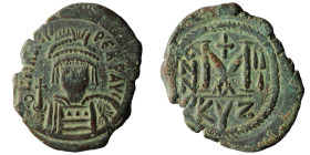 Heraclius. 610-641. AE follis . Cyzicus mint, struck 611/12. δ N hRACLI PЄRP AVC, helmeted ands cuirassed bust of Heraclius facing holding cross and s...