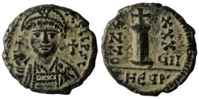 Justinian I Æ Decanummium. Ravenna, dated RY 35 = AD 561/2. [D N IVST]INIANVS P P AVG, helmeted and cuirassed bust facing, holding globus cruciger and...