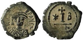 Maurice Tiberius (582-602) AE Decanummium.Constantinople.
Obv: Crowned, draped and cuirassed bust facing.
Rev: Large I; cross above, star to left, B...