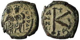 Justin II with Sophia, 565 - 578 AD
AE Half Follis, Nicomedia Mint
Obverse: Obverse: Justin on left and Sophia on right, seated facing on double thr...
