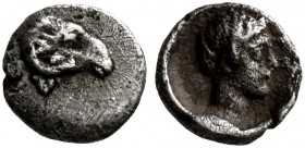 CARIA. Halikarnassos. 5th century BC. Hemitetartemorion (Silver, 5 mm, 0.10 g, 9 h). Head of a ram to right. Rev. Youthful male head to right. SNG Kec...
