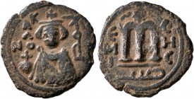 ISLAMIC, Umayyad Caliphate. temp. Mu'awiya I ibn Abi Sufyan, AH 41-60 / AD 661-680. Fals (Bronze, 20 mm, 3.46 g, 6 h), Arab-Byzantine type, Hims. K/A/...