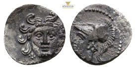 Cilicia, uncertain mint AR Obol. Circa 4th century BC. 0.58g, 10,7 mm, Facing gorgoneion / Head of Athena to left, wearing crested Corinthian helmet. ...