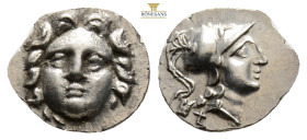 PISIDIA. Selge. Ca. 4th century BC. AR obol (0,86 g. 12,6 mm, ). NGC AU. Head of gorgoneion facing with flowing hair / Head of Athena right, wearing c...