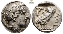 Attica. Athens circa 454-404 BC. Tetradrachm AR 24,2 mm. 17,2 g.
Helmeted head of Athena right, with frontal eye / AΘE, Owl standing right, head faci...