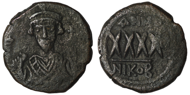 Phocas. (605-606 AD). Æ 40 Nummi. Nikomedia. Obv: bust of Phocas facing. Rev: AN...