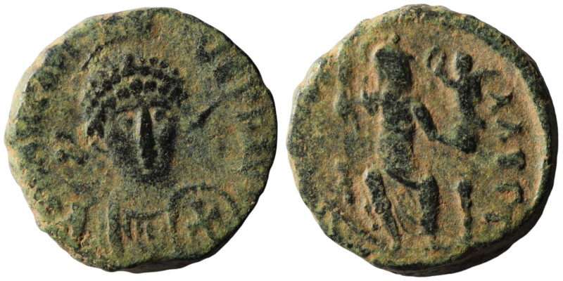 Arcadius. (401-403 AD). Follis. Obv: DN ARCADIVS PF AVG. helmeted bust of Arcadi...