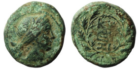 Mysia. Kyzikos. (around 50 BC). Bronze Æ. (19mm, 5,63g) Obv: head of Kore right. Rev: monogram in wreath.
