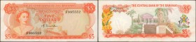 BAHAMAS. Central Bank of the Bahamas. 5 Dollars, 1974. P-37a. About Uncirculated.
A bright orange QEII 5 Dollar Donaldson signed piece with a near fa...