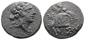Amisos 85-65 BC. AE (21,8mm. 7,7g.). Head of young Dionysos right, wearing ivy wreath. Rev. Cista mystica, panther skin, diadem and thyrsos; monogram ...