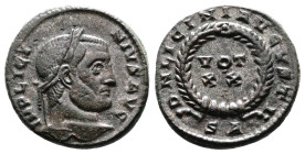 Licinius I, AD 308-324. AE Follis. (18,3 mm. 3,4 g.). Arles. IMP LICINIVS AVG, laureate head right. Rev. DN LICINI AVGVSTI around VOT XX in wreath. Mi...