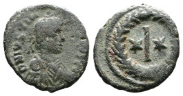 Justinian I. AD 527-565. AE 10 nummis (15,8 mm. 2,5 g.). Rome mint. DN IVSTINIANVS P AVG, pearl-diademed, draped and cuirassed bust right. Rev. Large ...