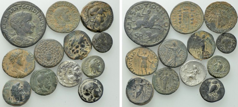 12 Roman Provincial and Greek Coins. 

Obv: .
Rev: .

. 

Condition: See ...