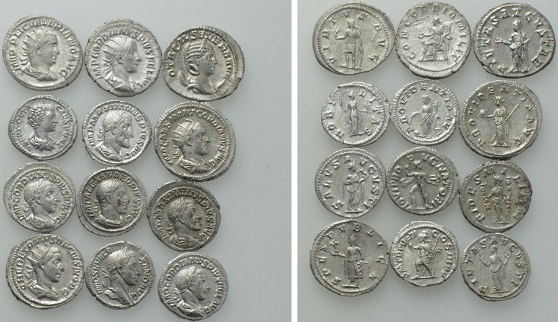 12 Roman Silver Coins. 

Obv: .
Rev: .

. 

Condition: See picture.

We...