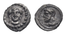 CILICIA. Uncertain mint. Circa 4th century BC. Tetartemorion (Silver, 6.18 mm, 0.15 g). Female head facing, wearing circular earrings. Rev. Bare and b...