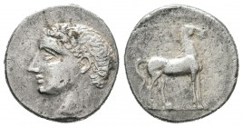 Cartagonova. 1/2 siclo-1/2 shekel. 220-205 a.C. Cartagena (Murcia). (Abh-542). Anv.: Cabeza viril desnuda a izquierda. Rev.: Sobre línea, caballo para...