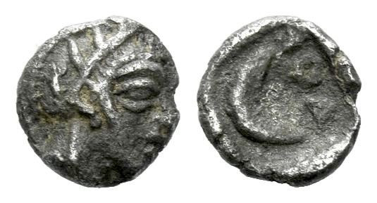 Attica, Athens Tetartemorion circa 400-353, AR 6.00 mm., 0.16 g.
Helmeted head ...